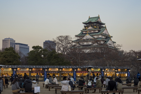 Osaka, DEC 19: Street vendors and the famous Osaka Castle on DEC 19, 2016 at Osaka, Japanのeditorial素材