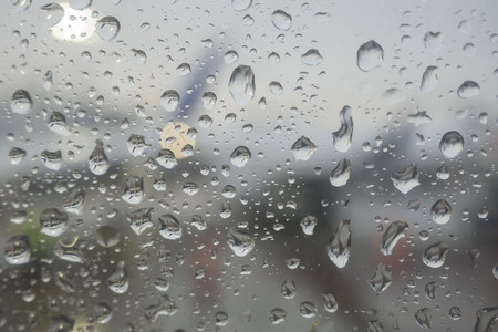Macro shot of  water drops on a glass windowの写真素材