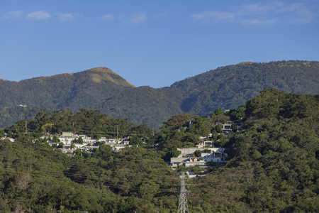 Beautiful mountain view with some building and blue sky at Taipei, Taiwanの写真素材