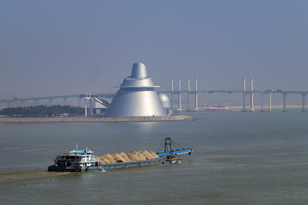 Macau, DEC 31: Morning view of Macao Science Center and Amizade Bridge on DEC 31, 2016 at Macau, Chinaのeditorial素材