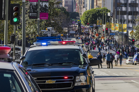 Los Angeles, JAN 21: Police car standby in the special Women March event and Protesters on JAN 21, 2017 at Los Angeles, Californiaのeditorial素材