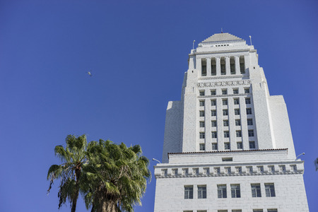 The famous City Hall of Los Angeles with blue sky and helicopter at morningのeditorial素材