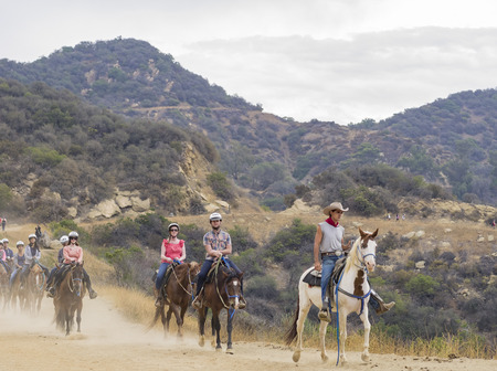 Los Angeles, JUL 20: Horseback riding in Hollywood Hills trail on JUL 20,2014 at Los Angelesのeditorial素材