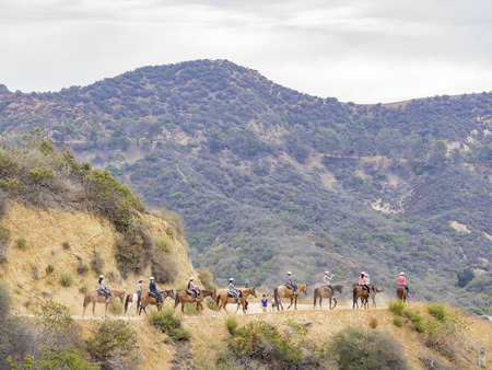 Los Angeles, JUL 20: Horseback riding in Hollywood Hills trail on JUL 20,2014 at Los Angelesのeditorial素材