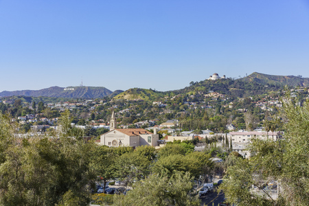 Los Angeles, MAR 9: cityscape with LA Full Gospel Church, Hollywood sign and Griffith Observatory around Barnsdall Art Park on MAR 9, 2017 at Los Angeles, Californiaのeditorial素材