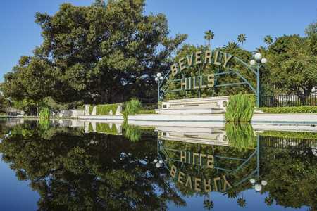 Beverly Hills, MAR 24: Beverly Hills Sign with reflection on MAR 24, 2017 at Beverly Gardens Park, Los Angeles, Californiaのeditorial素材