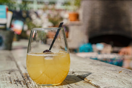 Enjoy an Irish cocktail with a cherry in the garden during happy hour