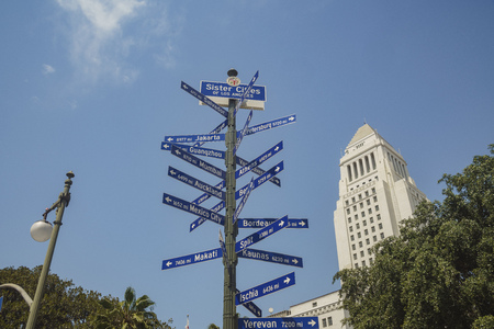 The famous City Hall of Los Angeles with sign of sister cities at morningの写真素材