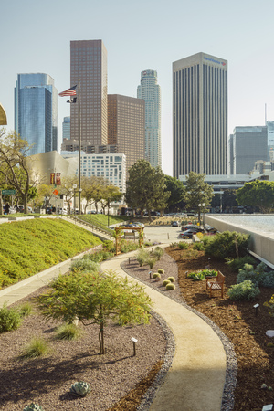 Los Angeles, APR 11: Downtown skyscapper skyline and dirt road on APR 11, 2017 at Los Angelesのeditorial素材