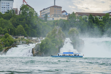 The biggest waterfall - Rhine Falls with ship at Europe, Zurich, Switzerlandのeditorial素材
