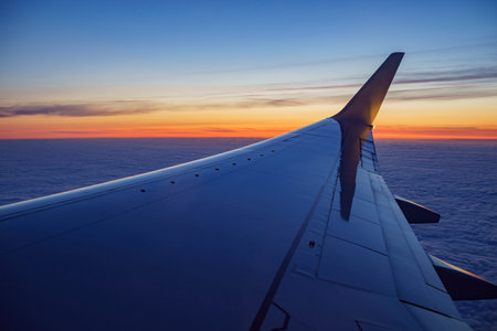 Sunset view of sky from a window seat in an airplane at Los Angeles, California, U.S.A.