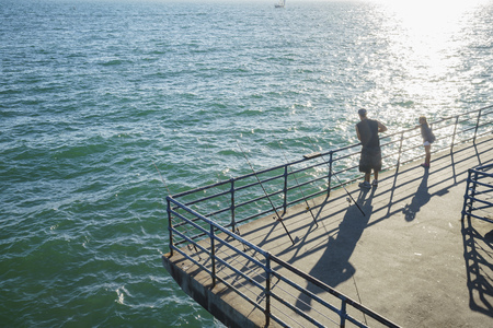 Santa Monica, JUN 21: Many fishing rod standing at a corner waiting for fish on JUN 21, 2017 at Santa Monica, Los Angeles County, California, United Statesのeditorial素材