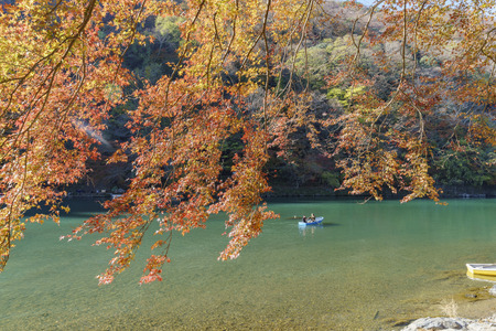 Kyoto, NOV 24: Beautiful fall color and Katsura River with boat on NOV 24, 2017 at Arashiyama, Kyoto, Japanのeditorial素材