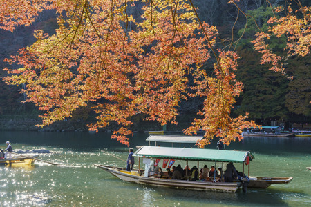 Kyoto, NOV 24: Beautiful fall color and Katsura River with boat on NOV 24, 2017 at Arashiyama, Kyoto, Japanのeditorial素材