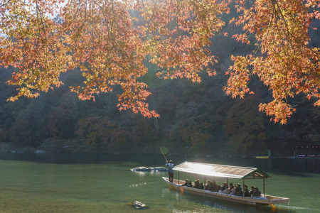 Kyoto, NOV 24: fall color and Katsura River with boat on NOV 24, 2017 at Arashiyama, Kyoto, Japanのeditorial素材