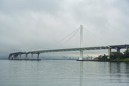 The beautiful San Francisco Oakland Bay Bridge in a cloudy day, California