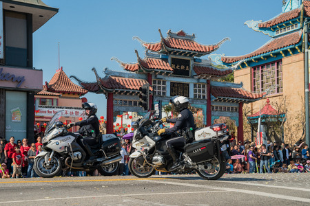 Los Angeles, FEB 17: Police with motorbike at Golden Dragon Parade on FEB 17, 2018 at Los Angeles, Californiaのeditorial素材