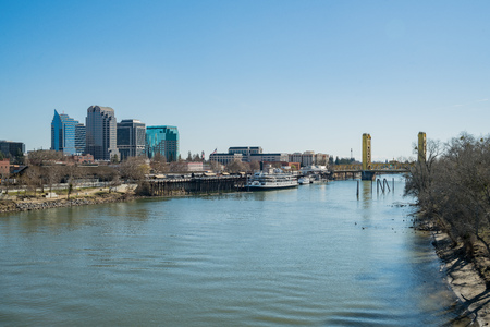 Sacramento, FEB 21: Afternoon view of Sacramento skyline with Sacramento River on FEB 21, 2018 at Sacramento, Californiaのeditorial素材