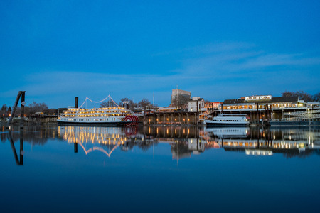 Sacramento, FEB 22: Night view of Sacramento skyline with Sacramento River on FEB 22, 2018 at Sacramento, Californiaのeditorial素材