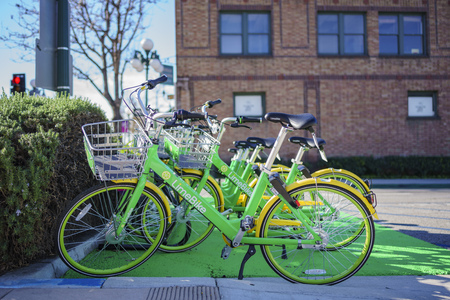 Monrovia, MAR 19: Green LimeBike in the Library Park on MAR 19, 2018 at Monrovia, Los Angeles County, Californiaのeditorial素材