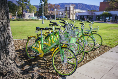 Monrovia, MAR 19: Green LimeBike in the Library Park on MAR 19, 2018 at Monrovia, Los Angeles County, Californiaのeditorial素材