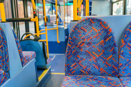 Interior view of a bus with empty seat at London, United Kingdomの写真素材