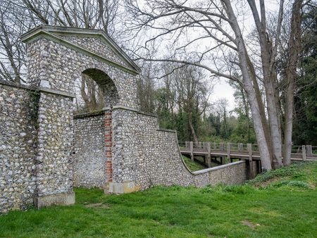 Country side view with a stone wall and gate at Chichester, United Kingdomの写真素材