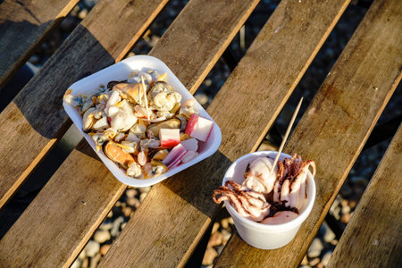 Close up shot of two bowls of mix seafood, contains octopus, crab, snails, musselsの写真素材