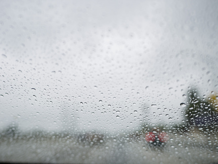 Close up shot of some water drops with car, city as background at Los Angeles, Californiaの写真素材