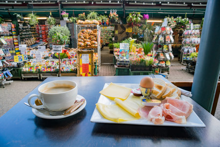 Close up shot of a breakfast set of ham, cheese, egg, bread and coffee, ate at Amsterdam flower...