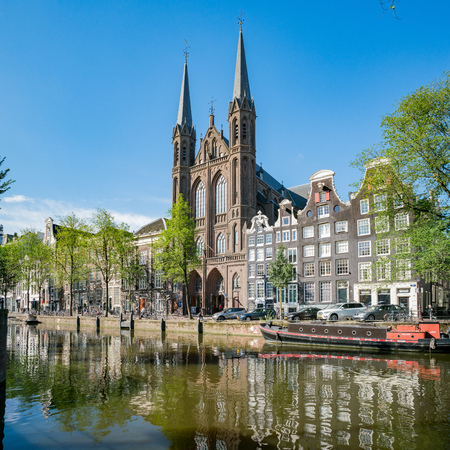 Amsterdam, JUL 22: De Krijtberg Church and the beautiful Canal on JUL 22, 2017 at Amsterdam, Netherlandsのeditorial素材