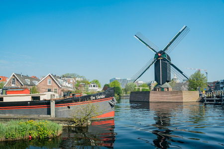 Leiden, APR 22: Molen De Put windmill and cityscape on APR 22, 2018 at Leiden, Netherlandsのeditorial素材