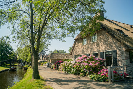 Giethoorn, JUL 22: Beautiful canal view and traditional house of Giethoorn on JUL 22, 2018 at Giethoorn, Netherlandsのeditorial素材