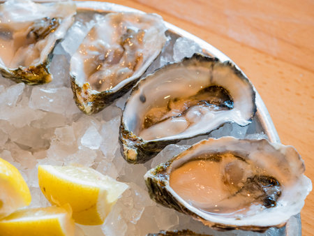 Close up shot of raw oyster with lemon, ate at Los Angeles