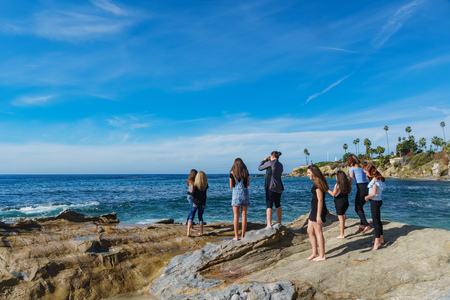 girl photographing on NOV 25, 2018 at Laguna Beach, Californiaのeditorial素材