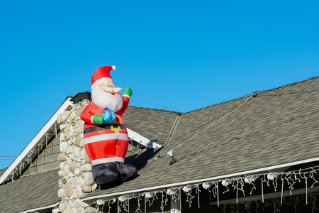 Santa Christmas decoration on a house chimney at Temple City, Los Angeles County, Californiaのeditorial素材