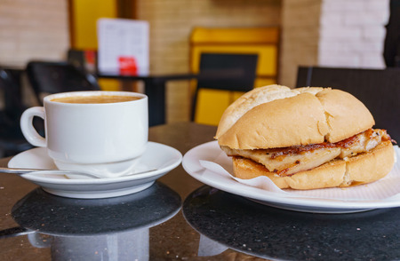 Close up shot of a coffee, pork chop bun with reflection, ate at Macauの写真素材