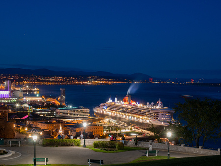 Night view of the famous cityscape and Queen Mary 2 at Quebec, Canadaのeditorial素材