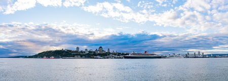Sunset view of the Quebec city skyline with Fairmont Le Chateau Frontenac, Queen Mary 2 at Quebec, Canadaのeditorial素材