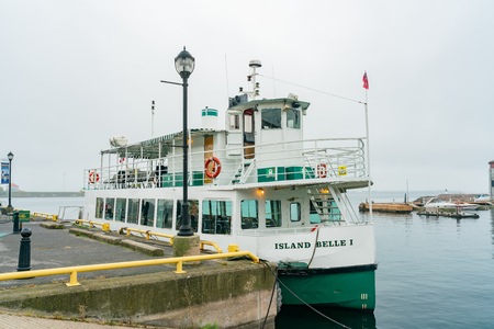 Kingston, OCT 5: Tourist ship on the harbor on OCT 5, 2018 at Kingston, Canadaのeditorial素材