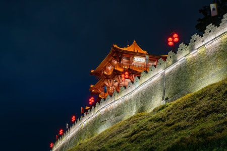 Night view of the Zhaoqing Ancient City Wall with Pi Yun Lou building at Chinaのeditorial素材
