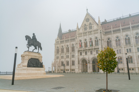 Foggy view of the Hungarian Parliament Building in a haze morning at Budapest, Hungaryのeditorial素材