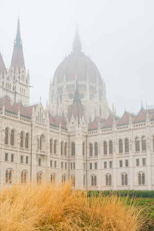 Foggy view of the Hungarian Parliament Building in a haze morning at Budapest, Hungaryのeditorial素材