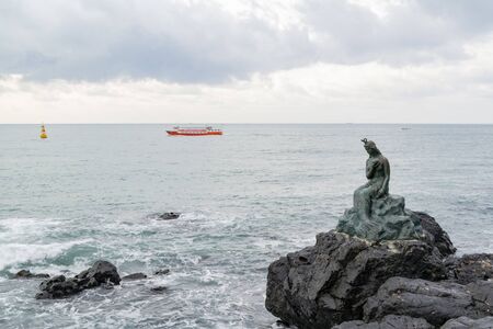 Morning view of the Busan Haeundae mermaid statue at Busan, South Koreaの写真素材