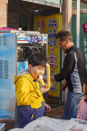 Busan, APR 3: Boy eating ice cream on APR 3, 2014 at Busan, South Koreaのeditorial素材