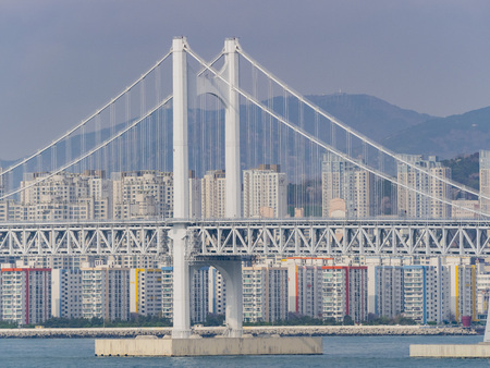 Many building with the Gwangan Bridge in the famous Haeundae District at Busan, South Koreaのeditorial素材