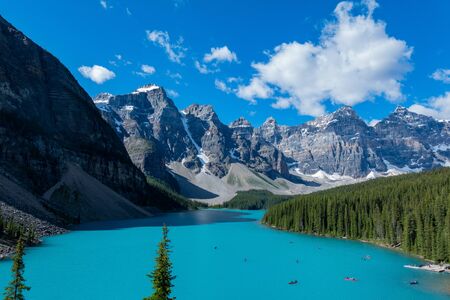 People kayaking in Moraine Lake at Banff National Park, Canadaの写真素材