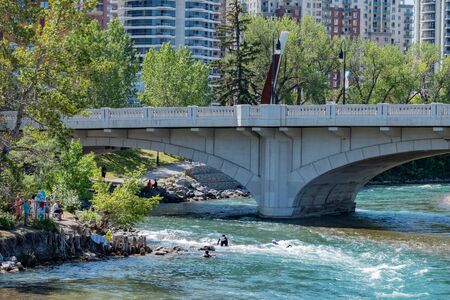 Calgary, AUG 3:  People playing under  the famous Louise Bridge on AUG 3, 2019 at Calgary, Canadaのeditorial素材