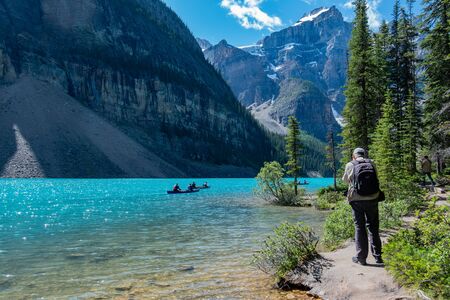 Banff, JUL 25: People kayaking in Moraine Lake on JUL 25, 2019 at Banff, Canadaのeditorial素材