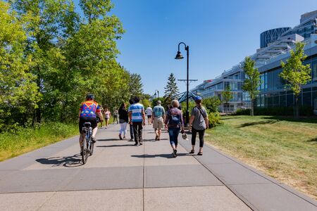Calgary, AUG 3:  People cycling around Sien Lok Park on AUG 3, 2019 at Calgary, Canadaのeditorial素材